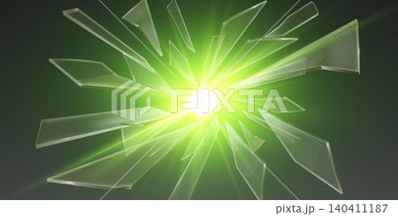 Transparent glass shards exploding from a bright green light source 140411187