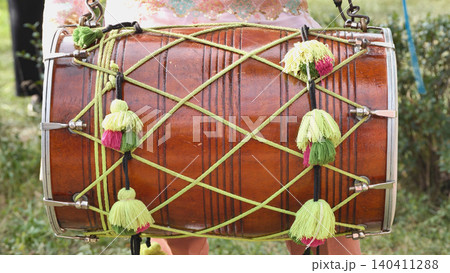 Dhol drum playing during India Day celebration in Moscow, vibrant Indian culture event Dhol drum playing during India Day celebration in Moscow, vibrant Indian culture event 140411288