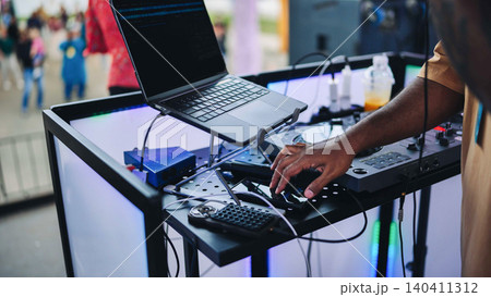 DJ playing music at India Day festival in Moscow, spinning tracks for outdoor event DJ playing music at India Day festival in Moscow, spinning tracks for outdoor event 140411312