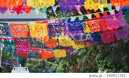 Colorful Papel Picado Banners Decorating a Latin American Fiesta Colorful Papel Picado Banners Decorating a Latin American Fiesta 140411382