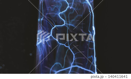 Plasma lamp displaying electric blue energy discharges on black background Plasma lamp displaying electric blue energy discharges on black background 140411641