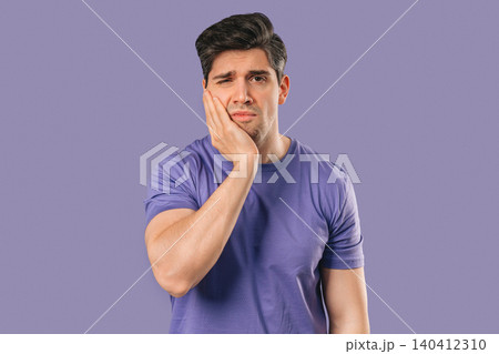 Mature Man Touching Cheek With Painful Expression, Reacting To Sudden Toothache Mature Man Touching Cheek With Painful Expression, Reacting To Sudden Toothache 140412310
