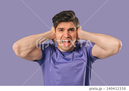 Stressed Shocked man Shouting, Guy In Shock on violet.Panicked facial expression Stressed Shocked man Shouting, Guy In Shock on violet.Panicked facial expression 140412338