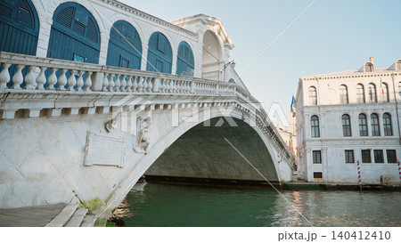 Grand Canal In Venice With Boat Floating Under the Rialto Bridge, Historic Architecture Grand Canal In Venice With Boat Floating Under the Rialto Bridge, Historic Architecture 140412410