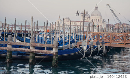 Gondolas on Venice canal with Basilica Santa Maria della Salute in background Gondolas on Venice canal with Basilica Santa Maria della Salute in background 140412428