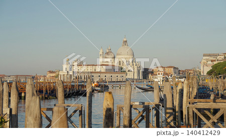 Gondolas on Venice canal with Basilica Santa Maria della Salute in background Gondolas on Venice canal with Basilica Santa Maria della Salute in background 140412429