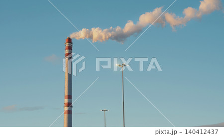 Industrial Smokestack Emitting Smoke Air Pollution Into The Sky. District Heatin 140412437
