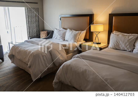 Home design. Furniture for bedroom. Interior design in apartment. Comfortable bed in hotel bedroom. Bedding and accommodation. Hotel room with cozy bed in bedroom. Home furniture Home design. Furniture for bedroom. Interior design in apartment. Comfortable bed in hotel bedroom. Bedding and accommodation. Hotel room with cozy bed in bedroom. Home furniture 140412703