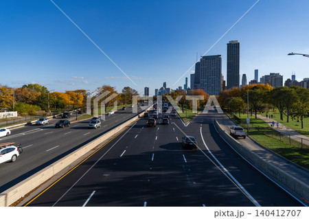 Chicago, Illinois, USA - October 25, 2024: Road way with car. City road full of car. Urban autumn. Urban road way highway. Car traffic on autumn road highway. City destination highway Chicago, Illinois, USA - October 25, 2024: Road way with car. City road full of car. Urban autumn. Urban road way highway. Car traffic on autumn road highway. City destination highway 140412707