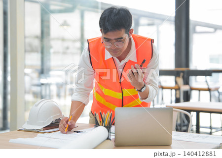 Engineer and Architect Reviewing Interior Plans 140412881