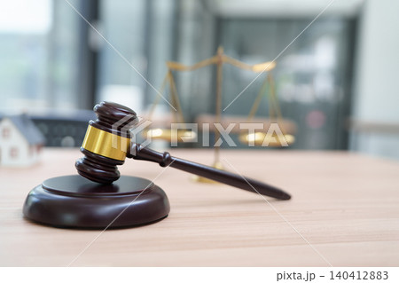 Wooden Gavel and Scales of Justice in an Office Setting for Legal Representation Wooden Gavel and Scales of Justice in an Office Setting for Legal Representation 140412883
