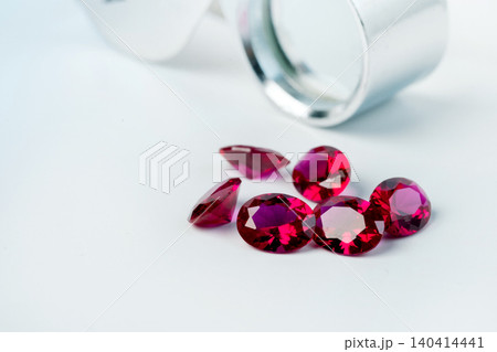 Red Ruby gemstone Round Cut isolate on white background, close up shot Red Ruby gemstone Round Cut isolate on white background, close up shot 140414441