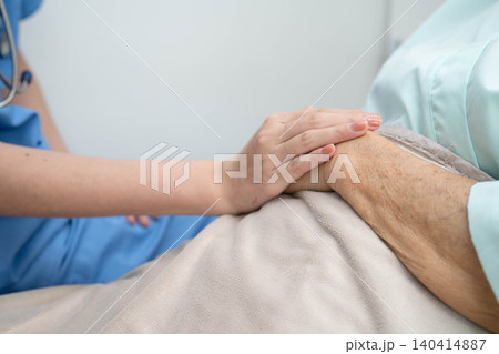Asian doctor checking and treat elderly woman patient health in hospital. Asian doctor checking and treat elderly woman patient health in hospital. 140414887