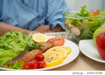 Asian elderly woman patient bored with food, anorexia loss of appetite. 140415589