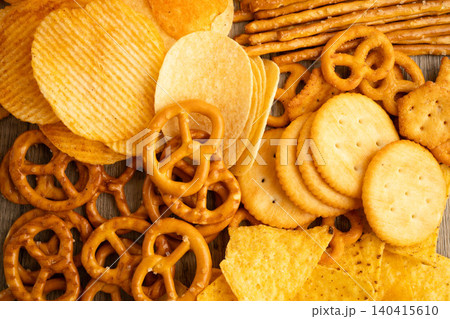 Mix of variety snack chips pretzel and cracker, junk crunchy food. 140415610