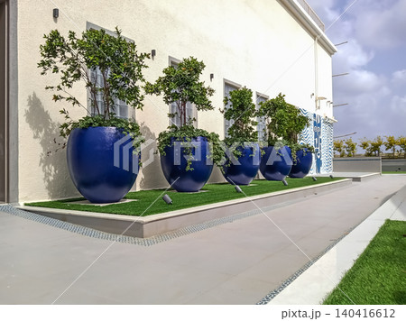 Modern Urban Terrace Garden with Lush Potted Trees and Artificial Turf contemporary rooftop garden design Modern Urban Terrace Garden with Lush Potted Trees and Artificial Turf contemporary rooftop garden design 140416612