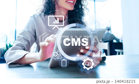 Working with a content management system on a tablet at a modern office Working with a content management system on a tablet at a modern office 140418215