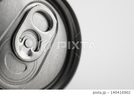 Macro shot of a silver metallic beverage can top with shallow depth of field on white background 140418902