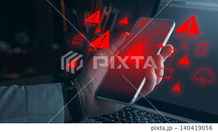 Scam call sms message warning displayed on a smartphone screen during the night Scam call sms message warning displayed on a smartphone screen during the night 140419056