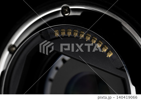 Detailed macro shot of camera lens electronic contacts with moody lighting on black Detailed macro shot of camera lens electronic contacts with moody lighting on black 140419066