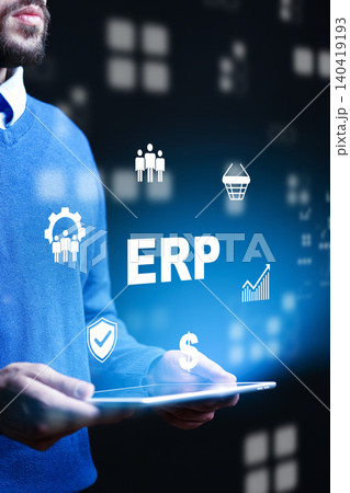 Business person using ERP software with graphics in dark environment for management tasks 140419193