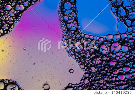 Abstract macro photography of soap bubbles and oil drops. High contrast, neon colors, and sharp details Abstract macro photography of soap bubbles and oil drops. High contrast, neon colors, and sharp details 140419256