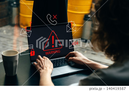 Scam call sms message warning on a laptop screen during a work session at a cafe 140419387