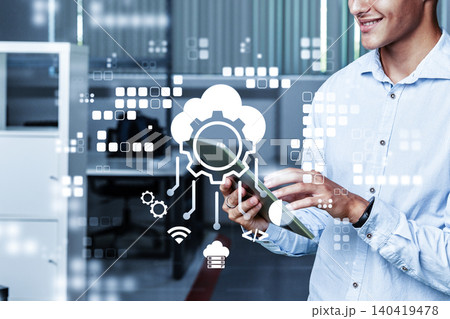 Man using tablet in office setting with digital icons for technology and management Man using tablet in office setting with digital icons for technology and management 140419478
