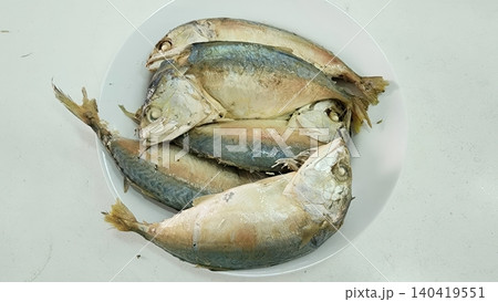 Fresh Steamed Short-bodied Mackerel (Pla Tu) Served on a White Ceramic Plate 140419551