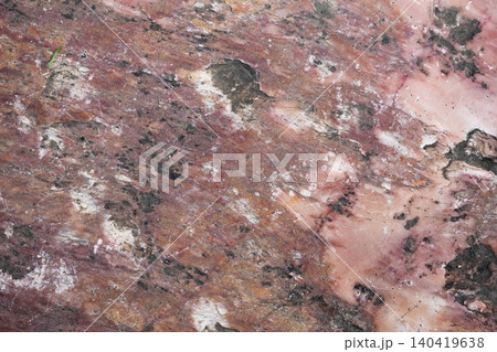 High-resolution overhead shot of raw pink marble featuring aged patina and dark mineral veins High-resolution overhead shot of raw pink marble featuring aged patina and dark mineral veins 140419638