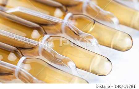 High-angle close-up of pharmaceutical vials organized in a transparent protective tray 140419791