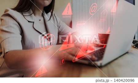 Scam message shows warning signs and alerts during online activity on a laptop Scam message shows warning signs and alerts during online activity on a laptop 140420096