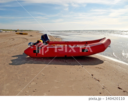 Beach, outdoor and inflatable boat on sand in nature by sea for travel in summer. Dinghy, transport and vessel on landscape, seashore or dock at harbor for sailing on journey by ocean in Australia Beach, outdoor and inflatable boat on sand in nature by sea for travel in summer. Dinghy, transport and vessel on landscape, seashore or dock at harbor for sailing on journey by ocean in Australia 140420110