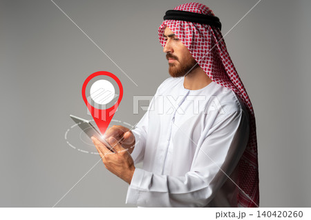 Man using tablet to plan a taxi route on a map in a city setting 140420260