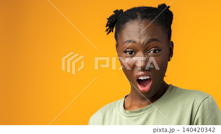 Person shows a strong reaction with an open mouth against a bright orange background Person shows a strong reaction with an open mouth against a bright orange background 140420342