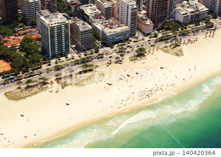Drone, beach and cityscape or sand with landscape for travel location, holiday and vacation in rio de janeiro. Aerial view, skyscraper and tourist on ocean in summer with street, water and waves Drone, beach and cityscape or sand with landscape for travel location, holiday and vacation in rio de janeiro. Aerial view, skyscraper and tourist on ocean in summer with street, water and waves 140420364