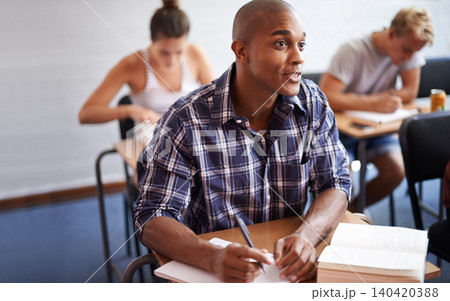 Black man, student and writing with book in classroom for studying, reading or summary at university. African male person or young academic writer with notebook for assignment, test or exam at campus Black man, student and writing with book in classroom for studying, reading or summary at university. African male person or young academic writer with notebook for assignment, test or exam at campus 140420388