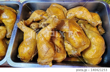 Braised Chicken Legs in Soy Sauce in Stainless Steel Tray at Thai Street Food Market Braised Chicken Legs in Soy Sauce in Stainless Steel Tray at Thai Street Food Market 140421253