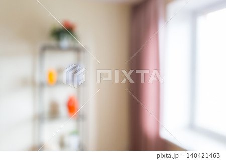 Room with a shelf filled with items and a window with light in the background Room with a shelf filled with items and a window with light in the background 140421463