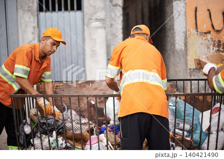 Waste, people and workers for municipal cleaning garbage on streets of urban city. Employees, service and orange uniform for job of trash collection, bags and plastic pollution in environment Waste, people and workers for municipal cleaning garbage on streets of urban city. Employees, service and orange uniform for job of trash collection, bags and plastic pollution in environment 140421490