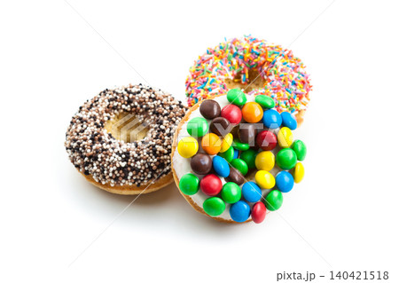 Different types of donuts with colorful toppings on a white background 140421518