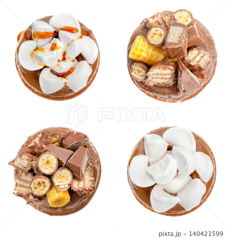 Different types of desserts on a white background with various toppings and chocolates 140421599