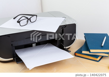 Office printer close up on a wooden table Office printer close up on a wooden table 140422075