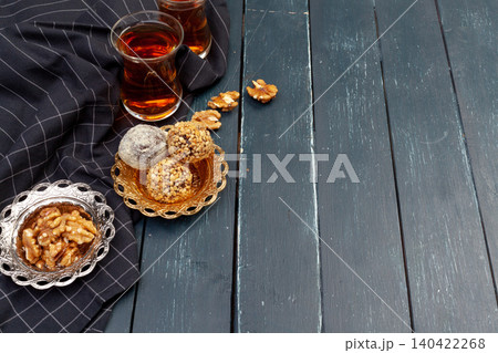 Nut balls dessert served with coffee on dark wooden table, top view 140422268
