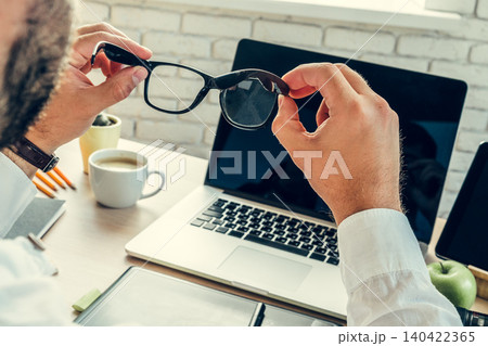 Close up of a businessman at his working table in office 140422365