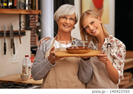 Portrait, happy woman and senior mother with pie in home, cooking or smile of family showing homemade food together in kitchen. Face, daughter and elderly mom with dessert, pastry or help with baking 140422593
