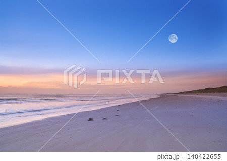 Beach, blue sky and ocean, landscape with nature and environment, moon and sand with travel destination. Horizon, waves and seascape with natural background, tropical location or island for holiday Beach, blue sky and ocean, landscape with nature and environment, moon and sand with travel destination. Horizon, waves and seascape with natural background, tropical location or island for holiday 140422655