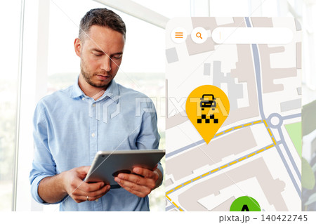 Travel map displaying taxi route with a person using a tablet in an urban area 140422745