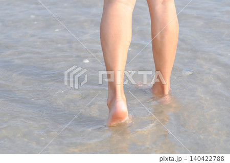 walking on the beach, beach and sand or sea or leg and feet walking on the beach, beach and sand or sea or leg and feet 140422788