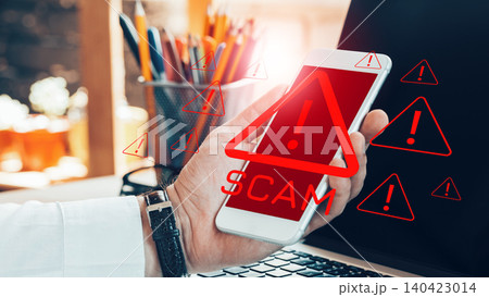 Warning about scam call sms messages on a smartphone in an office setting Warning about scam call sms messages on a smartphone in an office setting 140423014